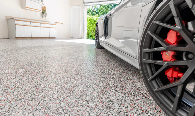 Finished flake epoxy garage floor with high-gloss topcoat ready for use in Thousand Oaks, CA
